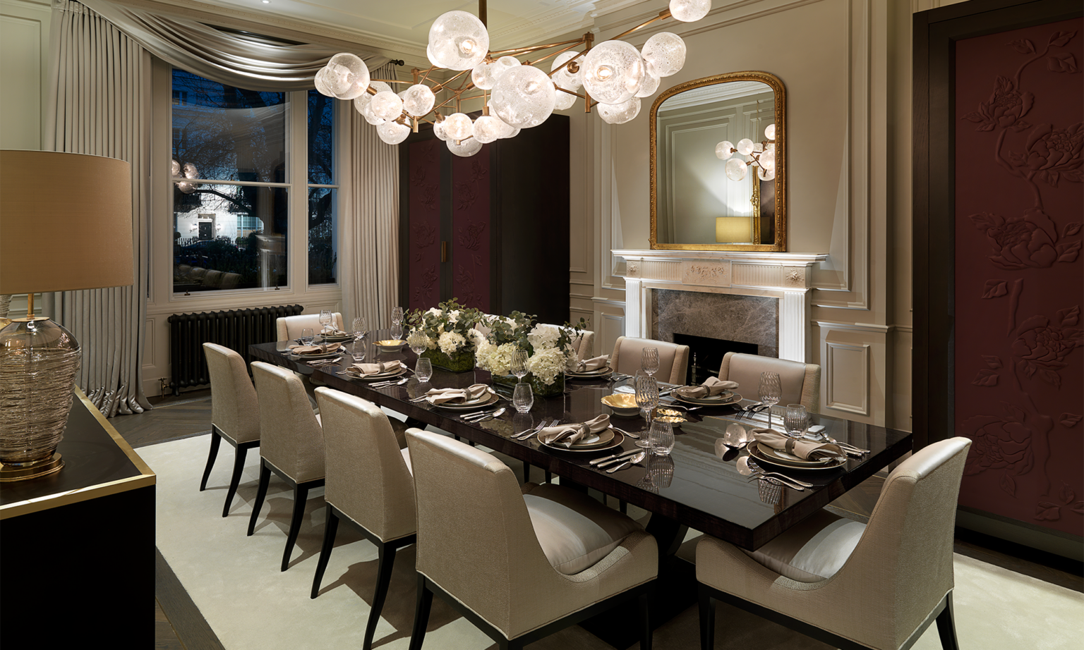 large dining table with beautiful lighting above