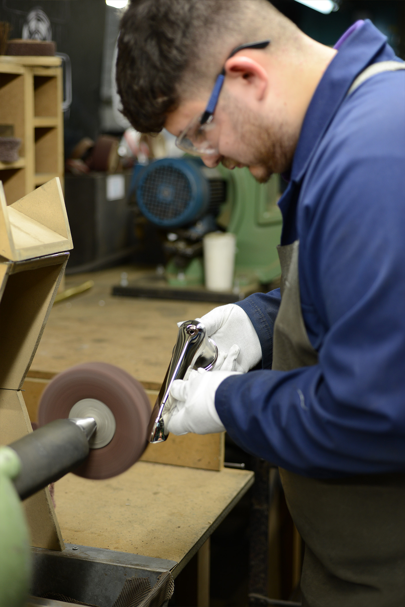 A young Polisher brushing a basin spout by hand