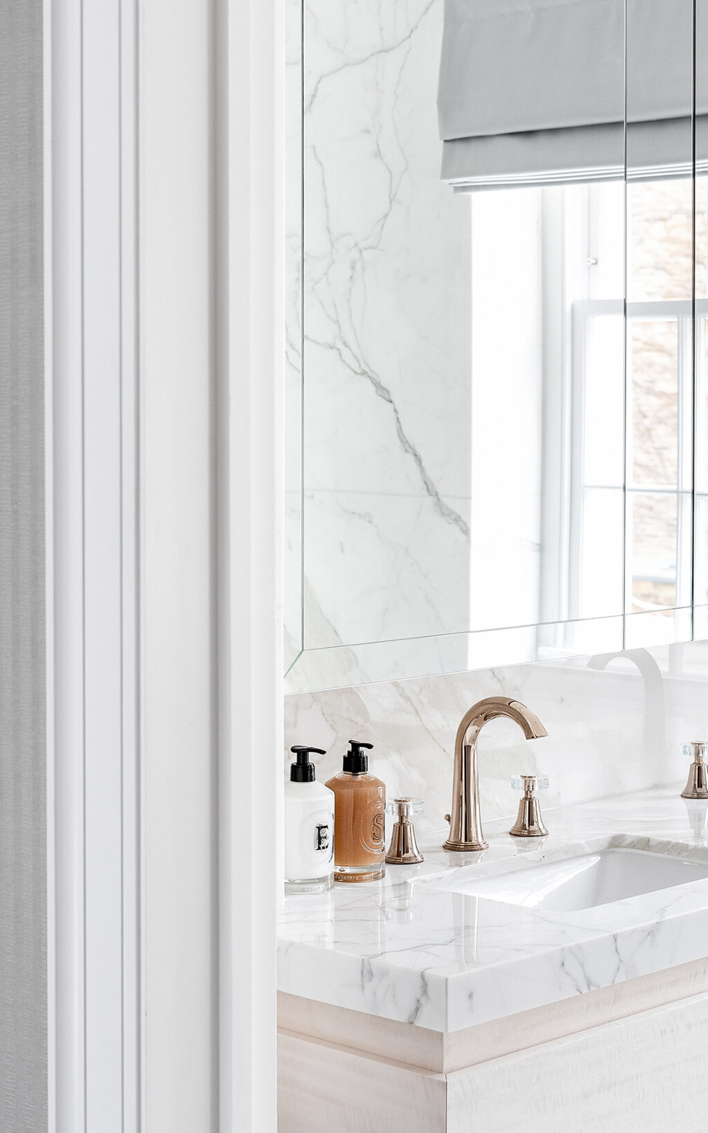 white bathroom gold interior