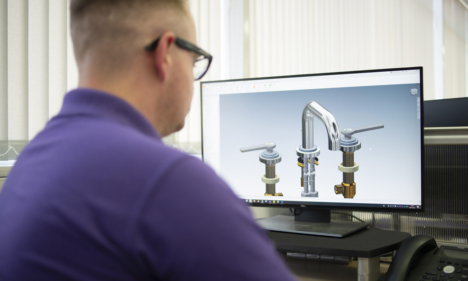 A design engineer producing 3D Computer Aided Design (CAD) drawings to optimise fitting instructions.